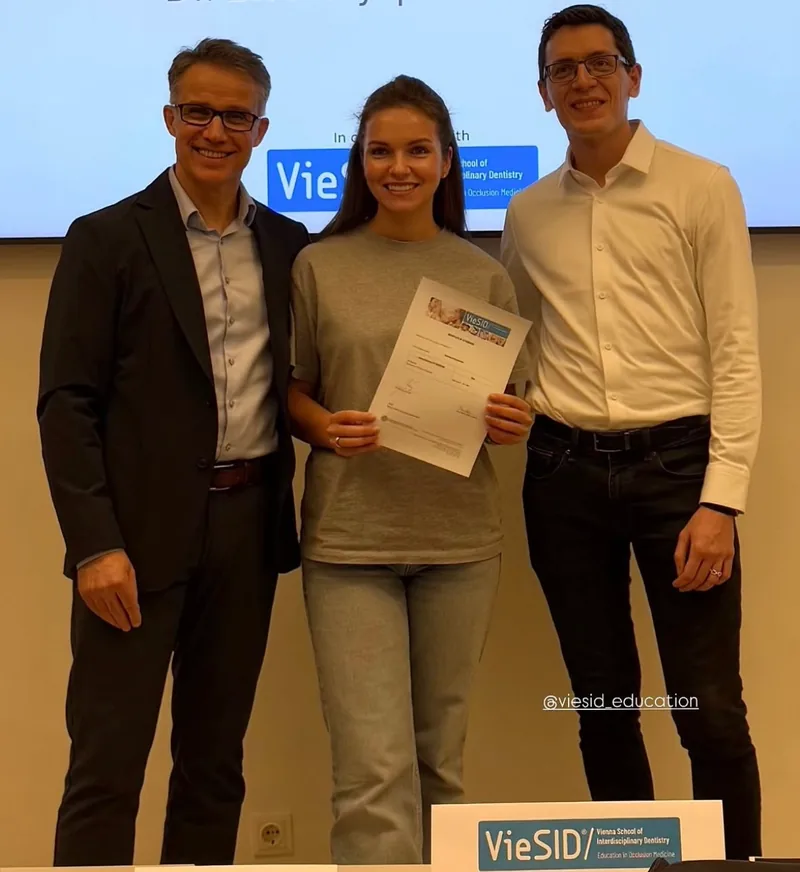 Dr. Svetlana Prisiazhnykh holding a certificate during her VieSID training